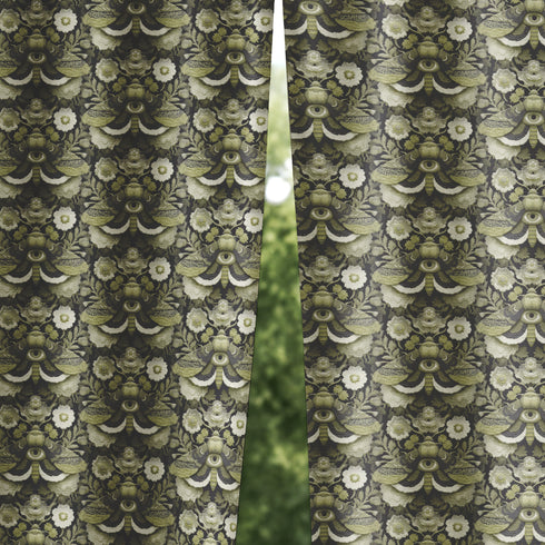 Blackout curtain panel featuring mystical moth pattern with all-seeing eyes, crescent moons, and botanical florals in olive green, cream, and charcoal colors on dark background. Heavyweight polyester fabric with rich satiny texture, rod pocket construction, gothic home decor, witchy aesthetic, occult symbolism, apothecary style window treatment for bedroom or living room